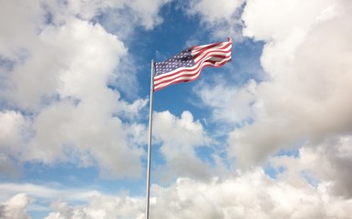 Fototapeta premium Composite image of low angle view of american flag