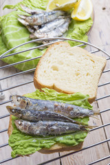 Sandwich Kamut, tapas with sardines, sprats with olives and herb