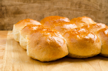 Fresh bun on wooden background