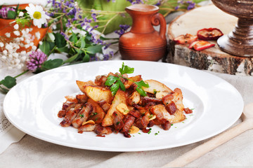 potato wedges with bacon on a plate