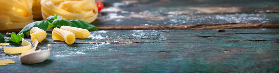 Italian food background with different types of pasta, health or vegetarian concept. Closeup, with copy space, horizontal