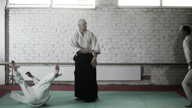 athletes in a kimono demonstrating martial arts techniques. martial arts