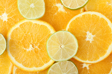 slices of orange and lime closeup in texture