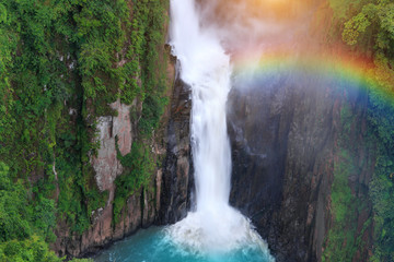Fototapeta na wymiar Haew Narok Waterfall with rainbow after rain in Khao Yai National Park, Thailand