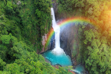 Fototapeta na wymiar Haew Narok Waterfall with rainbow after rain in Khao Yai National Park, Thailand