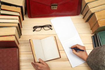 Follow the law. Professional lawyer sitting at the table and signing papers. On a wooden table...