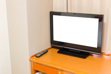 Close up blank TV on desk in room
