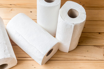 Roll of paper towel on wooden background