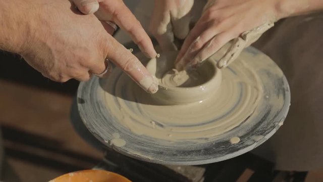 Woman tries to learn art of pottery for first time in her life.