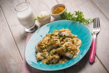 fillet fish with coconut milk and curry sauce