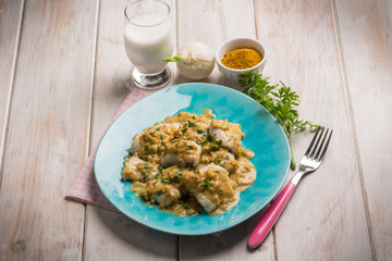 fillet fish with coconut milk and curry sauce