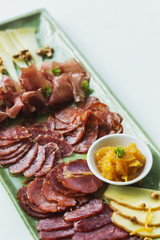 spanish serrano ham chorizo sausage and cheese tapas platter