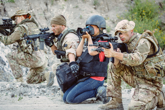 Photojournalist documenting war and conflict. in the mountain.