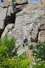 Boy climbing on the rock