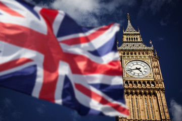 Fototapeta na wymiar British union jack flag and Big Ben Clock Tower and Parliament house at city of westminster in the background - UK votes to leave the EU