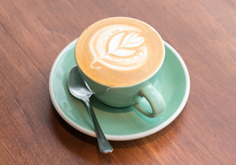 Latte or cappuccino on brown wooden
