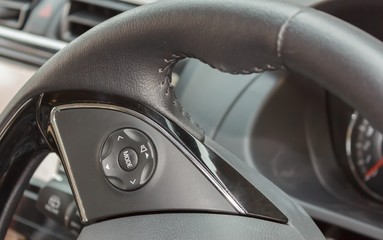 Obraz na płótnie Canvas Button control on the steering wheel of the car