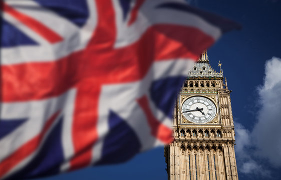 British union jack flag and Big Ben Clock Tower and Parliament house at city of westminster in the background - UK votes to leave the EU