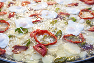 Boiling huge pan with eggs