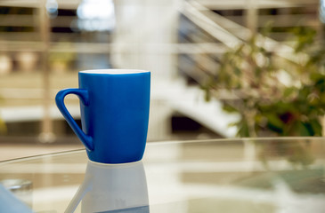 A cup of glass on the table