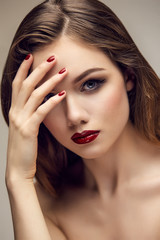 Classic red lips girl touching forehead