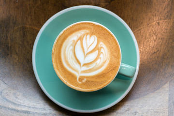Top angle view of coffee cup on wood background
