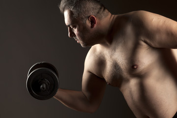Fototapeta na wymiar a fat man lift weights