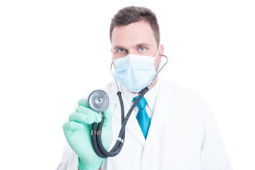 Male doctor holding stethoscope like consulting