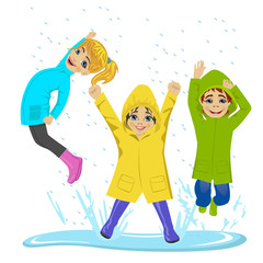 little kids playing on puddle wearing colorful raincoats and boots