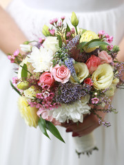 bride with wedding flower bouquet