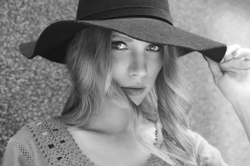 Beautiful fashionable young woman with hat portrait black and white