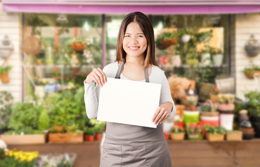 asian female florist with flower shop background