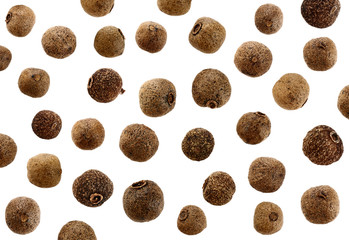 Grains of allspice isolated on white background.