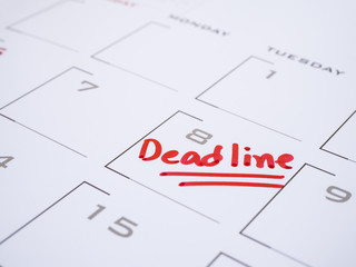 handwriting word Deadline on calendar desk 1
