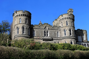 Fototapeta na wymiar Historic house with castle turrets