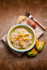 risotto with parmesan cheese and zucchinis flowers