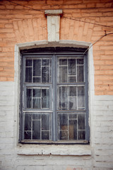 Obraz premium Old window in a stone wall