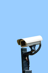 Security cameras (CCTV) or surveillance camera on pole isolated on blue background.