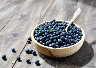 Blueberries in a bowl with a spoon