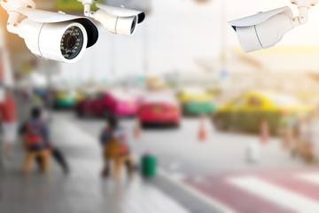 CCTV or surveillance camera recording of traffic in the parking lot for taxis carry passengers inside the departure hall of  the airport.