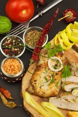 Grilled chicken steak with spices and vegetable. Dietary food for athletes. Healthy diet meals. Fried chicken. Steak ready for the grill.
