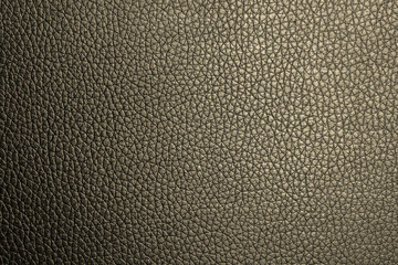 Closeup deep yellow leather texture for design. Leather background with copy space for text or image.