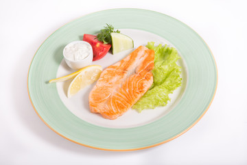 Salmon steak with vegetables