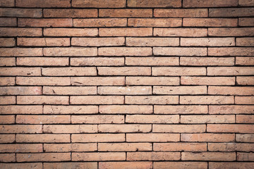 Obraz premium Closeup orange brick wall texture for background. Grunge retro vintage of brick wall. Part of old brick wall for design with copy space for text or image. Dark edged.