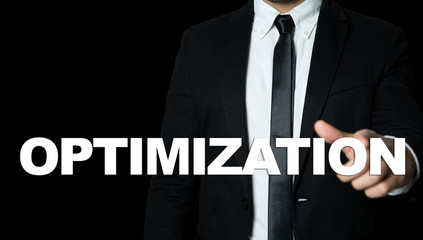 Business man pointing the text: Optimization