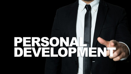 Business man pointing the text: Personal Development