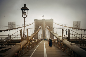 Walk on Brooklyn Bridge in a foggy day