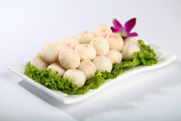 Fish ball with vegetables on plate