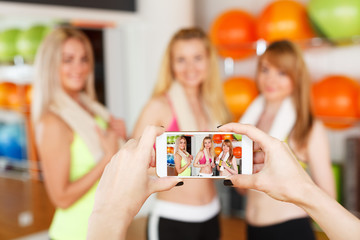 Taking photo of girlfriends. POV image, smartphone screen