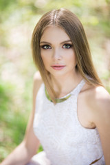 portrait of young woman in the forest